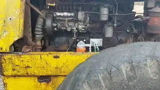 Michigan 75 with Volvo 6 cylinder diesel engine throttling up. No silencer.