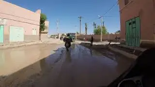 Drive through a Moroccan village on market day