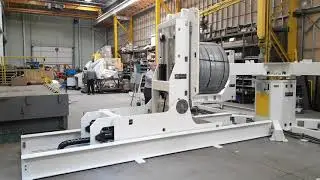 Mecon Industries traveling coil car upender. Turnstile loader
