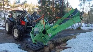 Pulls the wood processor out of a ditch after strong winds and tests it