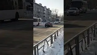 Escort of the bus by a police car with siren yelp