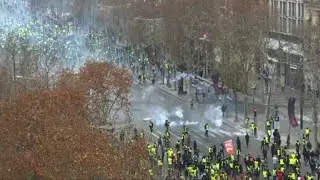 Police fire tear gas on Champs-Elysees' 'yellow vest' protests