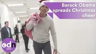 Barack Obama spreads Christmas cheer at Washington children's hospital