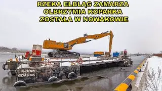 Rzeka Elbląg zamarza,olbrzymia koparka CAT została w Nowakowie.