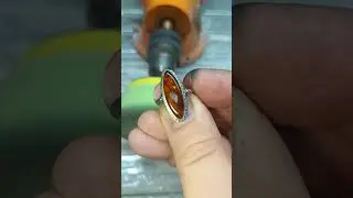Polishing an old amber ring.
