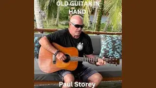 Old Guitar in Hand