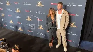 Halle Berry and Chris Hemsworth pose together backstage at CinemaCon in Vegas