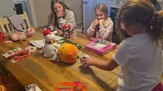 Ali guessing the candy and gifts from her sisters (8th Birthday).