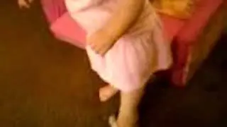 She loves Mommy's silver flip flops
