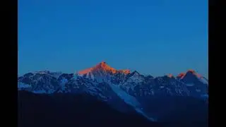 The golden sunrise over the main peak of Meili Snow Mountain
