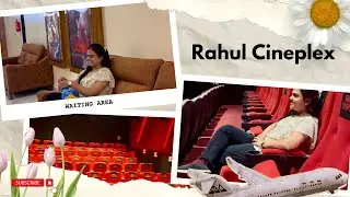A stylish cinema lobby with a snack bar, neon signs, and high-end seating l Rahul cineplex l