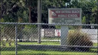 Father makes son hold 'I'm a bully' sign as punishment for bullying