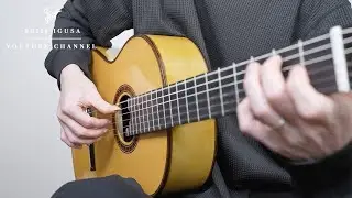 A handmade guitar made from paper.