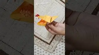 make a cute origami chicken that is eating his feed