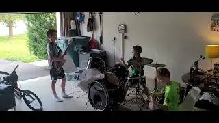 Molitor Garage Band - Doak playing around with the bass, Bodhi on drums + Row on electric.