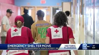 Flood-displaced residents move to new shelter