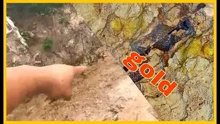 Natural gold mass in the open stream bed when the flood flashed through