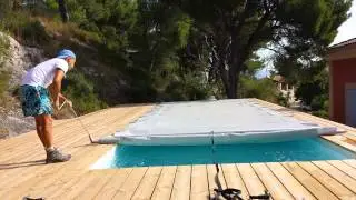 Dérouler une bâche à barre