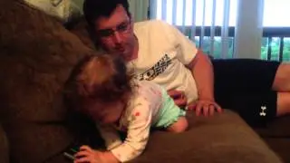 Wiggle grabs at Daddy's glasses