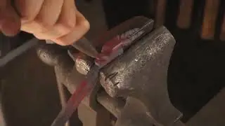 Artist Scultps Dragon Head On Metal Bar -1299565