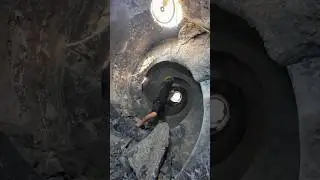 Cleaning out a concrete mixer drum
