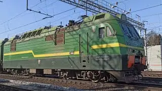 Freight train with electric locomotive 2ES4k - 047 with empty gondola cars from under coal