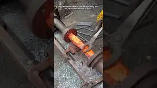 Blacksmith Forges Spiral Iron Bar