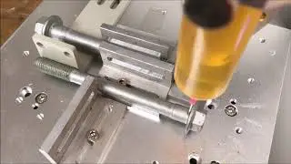 Adhesive Dispensing Ltd - 3 Axis Robot Applying Oil to Bolts