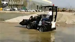 Heracles H160 Mini-loader - Test driving compact loader through Water