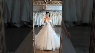 Soft flowing organza, sleek mikado with a cuff neckline, and details layered with sparkle tulle ✨