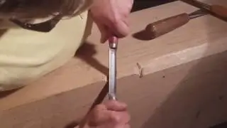 carving  a lambs tongue embellishment on white oak beam