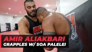 Amir Aliakbari grapples with Soa 