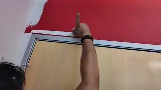 CUTTING WITH A  A PAINT BRUSH AROUND A DOOR