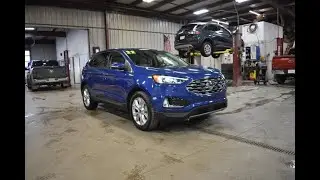 2023 Atlas Blue Ford Edge Titanium AWD SLT5263 Motor Inn Auto Group