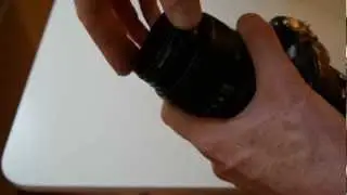 Attaching a reversed normal lens in front of a tele zoom lens for macro use