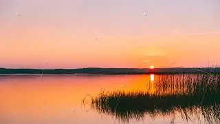 4K Sundown Above Lake River Horizon At Sunset. Natural Sky In Warm Colors Water. Sun Waters. Time