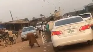 Yahoo boys spraying money in the streets of Benin city