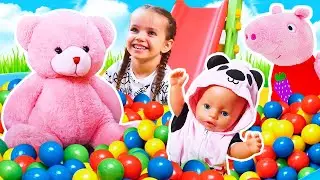 Maya plays mother to the baby doll, takes care of her, and plays with toys at home.