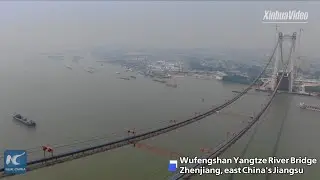Main cables of China's first road-rail suspension bridge erected