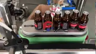Reliance 15ml Euro amber glass bottle labeling machine, essential oil labeler