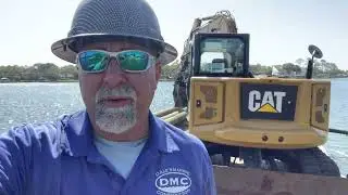 DEMOING A DOUBLE BOATHOUSE AND DOCK THEN INSTALLING A NEW DOCK THAT WAS RECLAIMED.