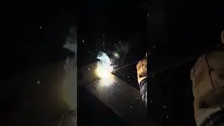Stick welding all around the base plate on a beam