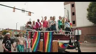 People On Board A Float Participating In A Street Parade
