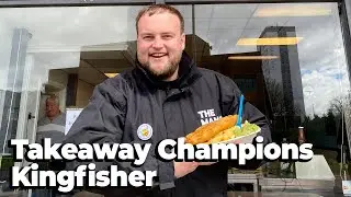 Joe nibbles on a deep-fried sausage at Kingfisher Chippy