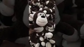 Brown monkey squeaky plush dog toy designed for chewing, teeth-cleaning and durable.
