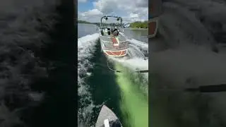 Wakesurfing behind Nautique 210