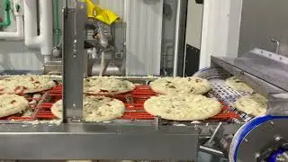 Frozen pizza assembly line in Wisconsin - includes sauce ploop!