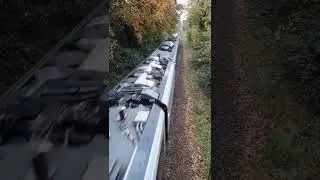 Train passes under bridge