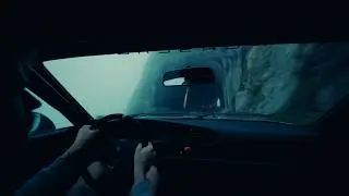 Driving in the misty swiss alps with the Porsche 944 turbo