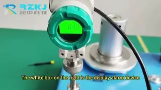 How do the pressure transmitter and the pressure alarm device work?